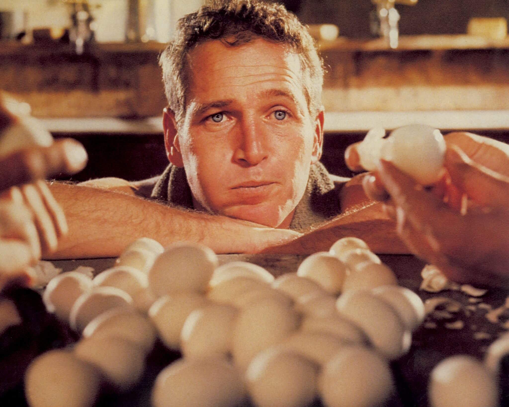 american-actor-paul-newman-as-luke-attempting-to-eat-fifty-news-photo-1573125072